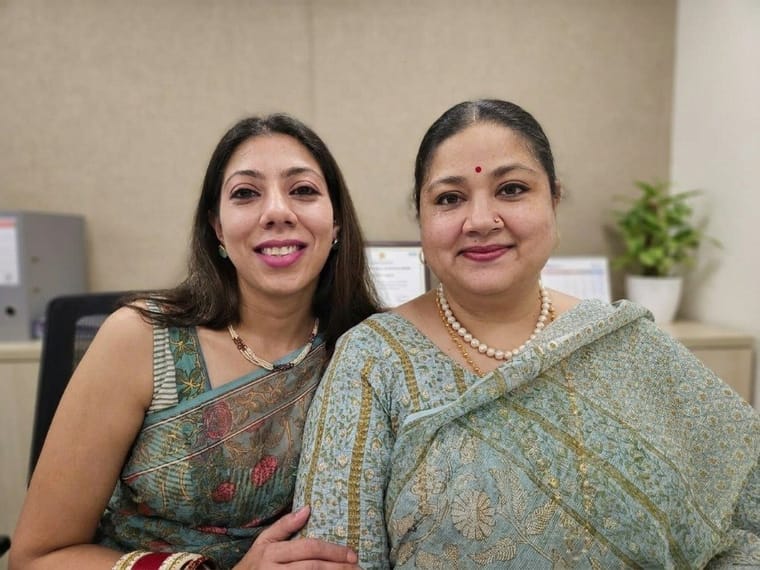 Side by side with a fellow corporate mother