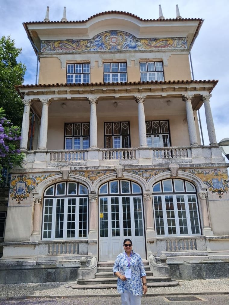 Lali Banerji outside the tiled conference venue in Lisbon
